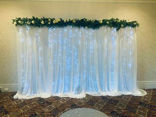 White Drapery with Flowers Backdrop - From $150